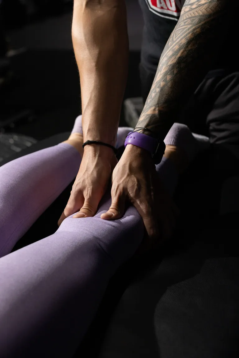 Joel providing assisted stretch therapy to a client